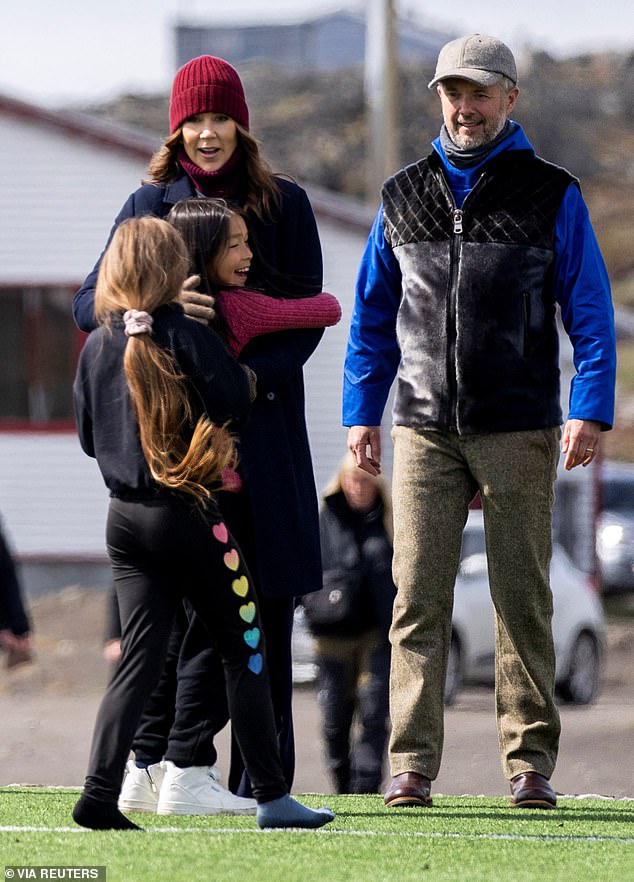 Local children warmly embraced the royal mother of four during the visit to Qeqertarsuaq in Greenland