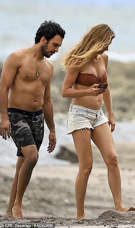 The couple looked relaxed as they spent their time on the beach