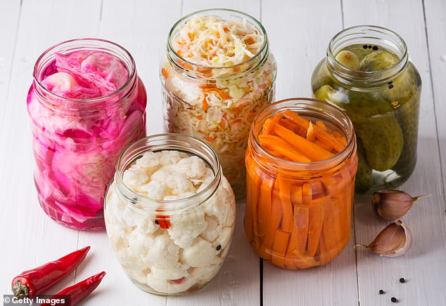 Fermented foods are made through fermentation, which uses bacteria or yeast to break down natural sugars
