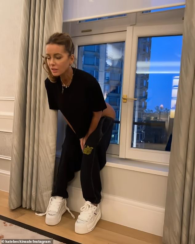 In the clip, Beckinsale wore a black T-shirt with black sweatpants and white sneakers, with her light brown locks in a ponytail, as she looked out a window to relieve the stress of the tense time.