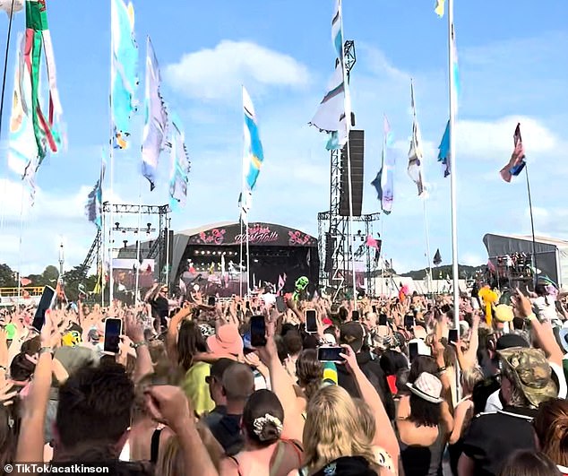 The Sugababes perform on stage at West Holts as fans hold up their phones to film