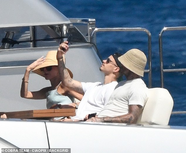 Romeo proved three is no crowd when he took a selfie with his dad on deck