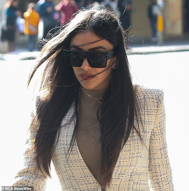 On Tuesday, Ms Daizli (pictured) wore a short, tight beige dress and a long white blazer with black high heels, believed to be Christian Louboutin pumps, as she appeared at Sydney's Downing Centre District Court for her trial. She also wore Louis Vuitton sunglasses