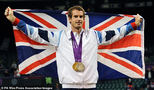 Britain's Andy Murray with his Olympic gold and silver medals at Wimbledon in 2012
