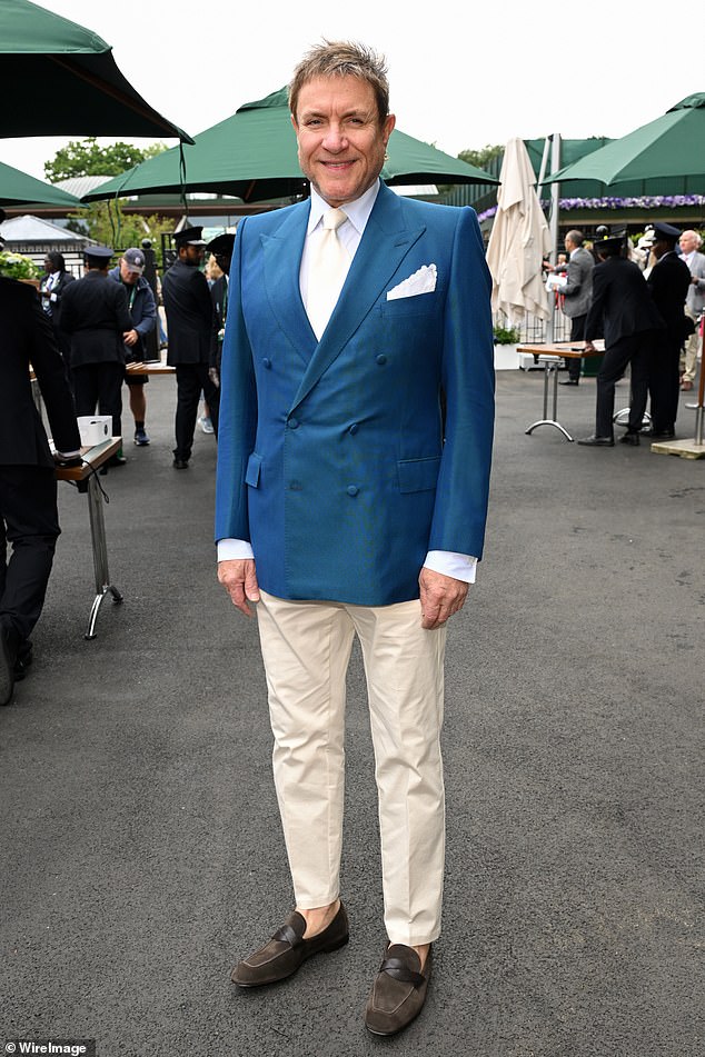 Simon Le Bon looked handsome in a navy blazer jacket as he suited up for the second day of Wimbledon on Tuesday