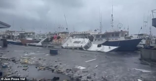 At least four people have died in the devastation that leveled the island of Carriacou in Grenada and damaged boats in Barbados (pictured)