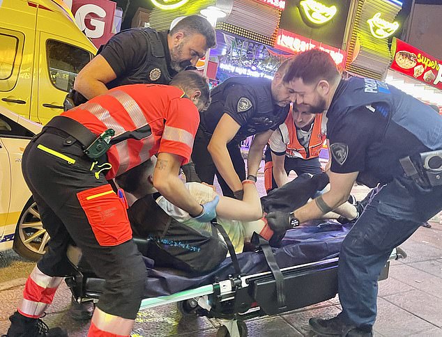 Paramedics rushed to the scene of the accident on the infamous Punta Bellena strip to place the man on a stretcher and then load him into an ambulance for treatment for suspected alcohol poisoning