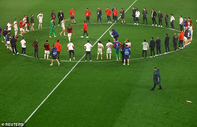 Turkey gathered on the centre circle as they celebrated the victory, with their players jumping up and down and celebrating the win