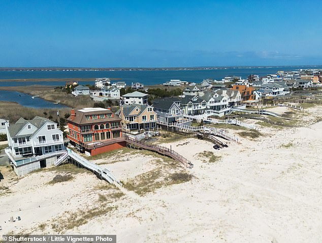At least one summer spot in New York's elite East Hampton village, Havens Beach, has been closed due to concerns about fecal and bacteria. Above, an aerial view of some Hamptons homes