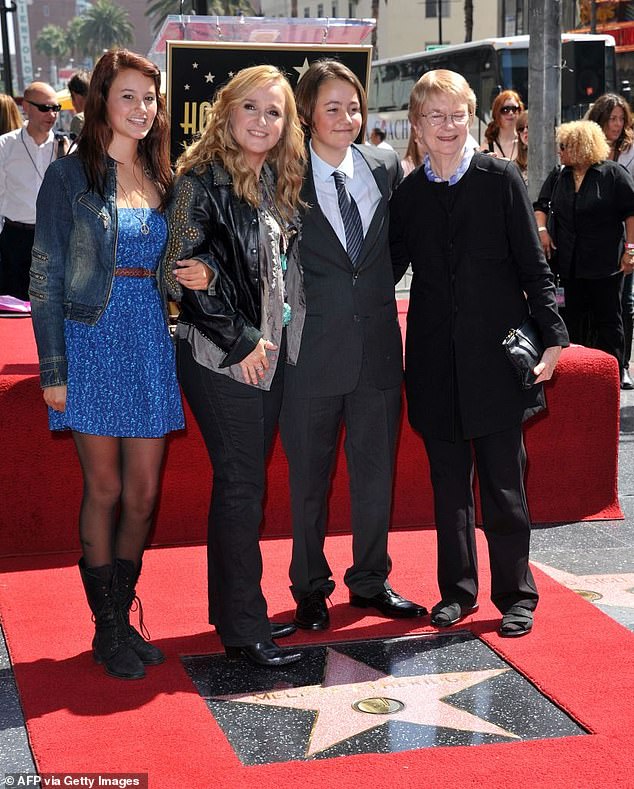 The Grammy winner shares daughter Bailey, now 27, and her late son Beckett with Cypher (the trio pictured with Melissa's mother Edna in Los Angeles in May 2020)