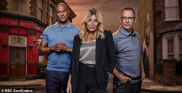 Michelle Collins' character Cindy Beale, who was murdered in 1998, is currently in a love triangle with her ex-husbands George Knight (Colin Salmon, left) and Ian Beale (Adam Woodyatt).