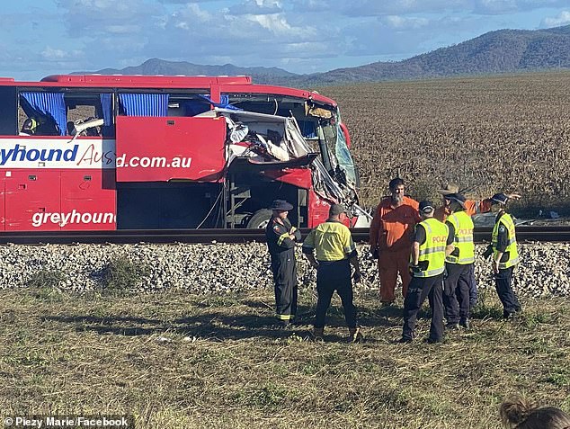Three women were killed and dozens of people were injured when a Greyhound bus (pictured) collided with a car towing a caravan on the Bruce Highway in North Queensland on Sunday
