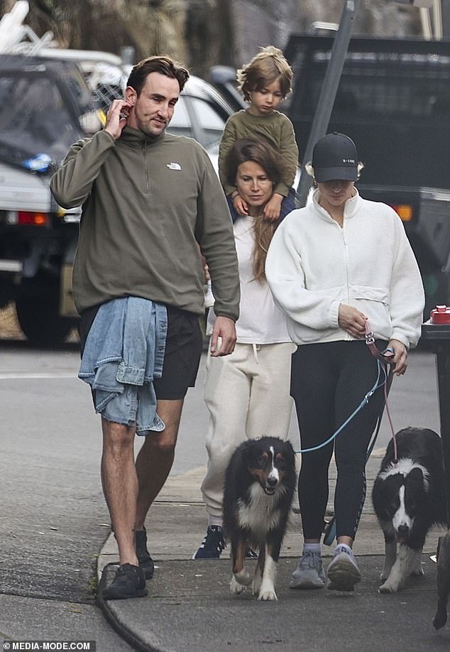 He kept himself comfortable in a pair of black sneakers as he took Vail and her son Jack, whom she had from a previous relationship, for a walk with the dog