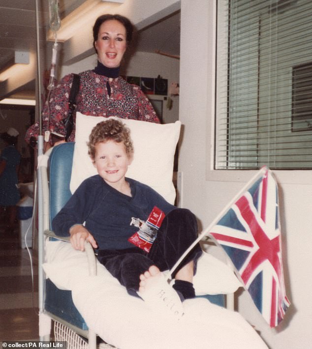 Patriotic Hamish, with a Union Jack on his hospital bed, endured 16 months of 'brutal' cancer treatment at Great Ormond Street Hospital after being diagnosed at the age of five