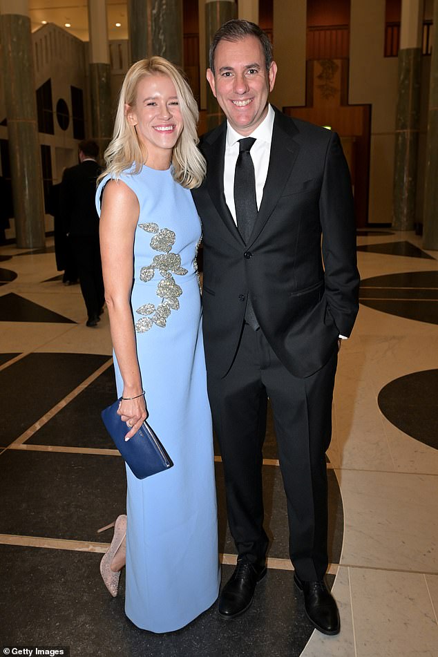 Jim Chalmers arrived arm in arm with his wife Laura, who wore a baby blue dress with rhinestones