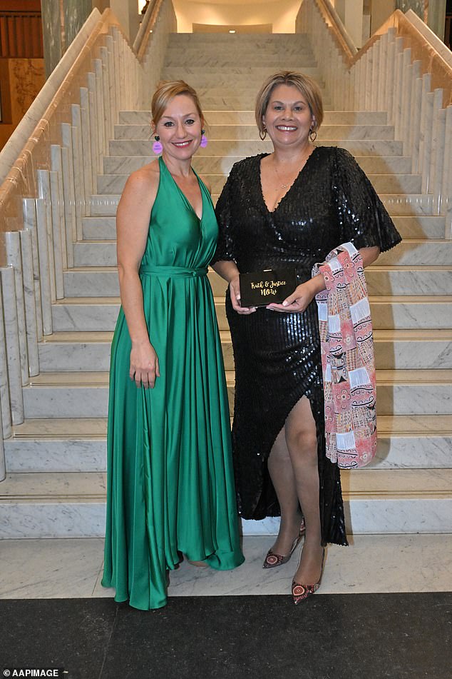 Green senators Larissa Walters and Dorinda Cox made their own statements in the form of props they brought to the ball