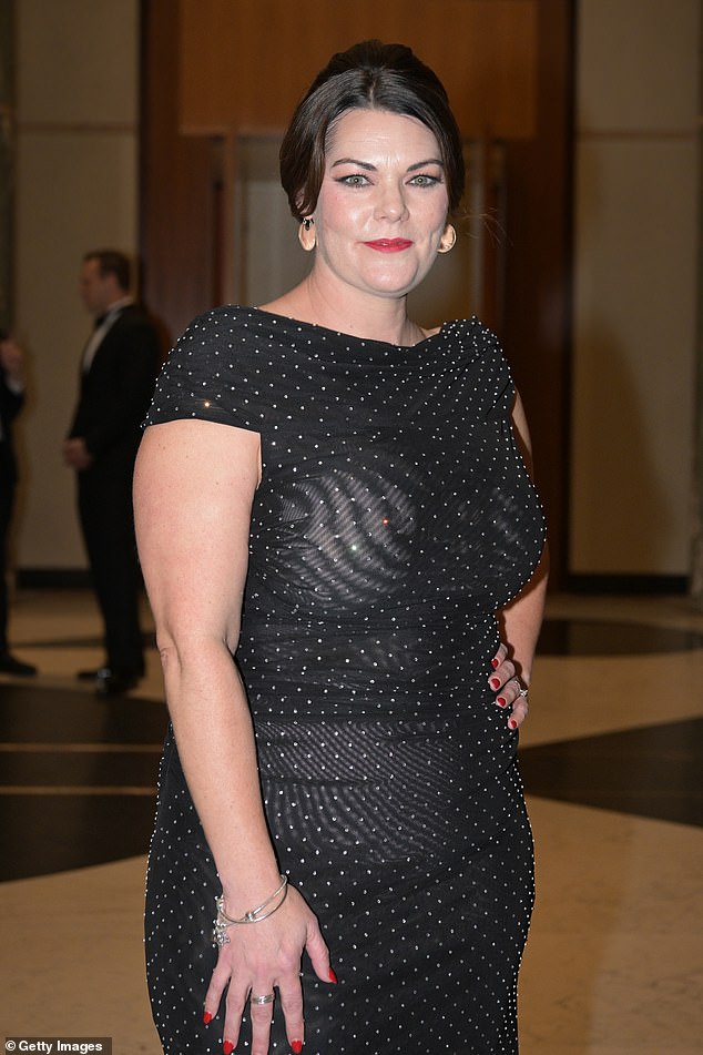 The outer layer of the dress, which sparkled under the light of diamonds, fell over the figure of the South Australian senator and ended at the ankles