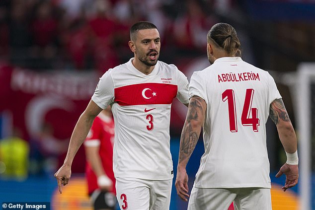 The gesture Demiral (left) is said to have made is banned in France and Austria