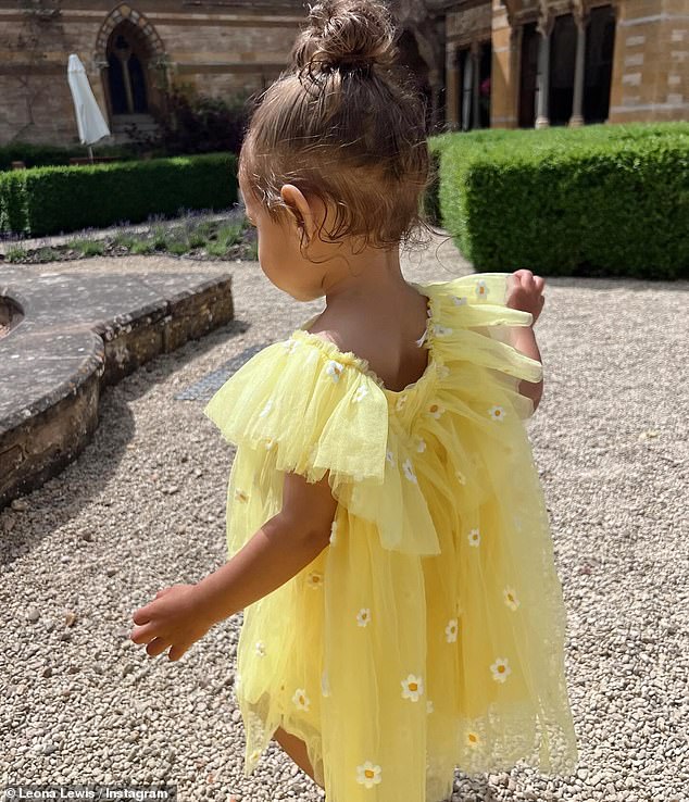 Meanwhile, Carmel's adorable ensemble was a light yellow tulle dress adorned with daisies
