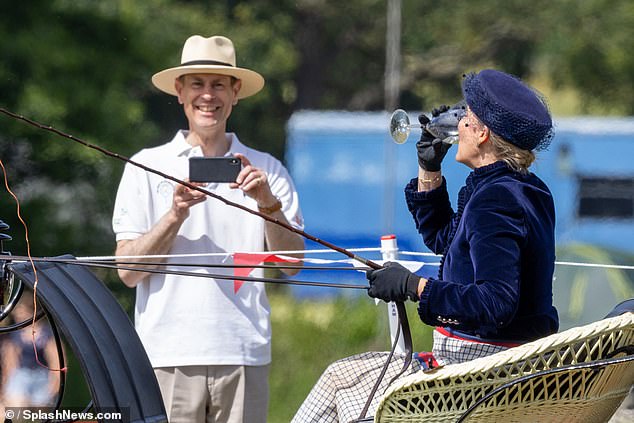 The Duke of Edinburgh was spotted with a big grin on his face and captured the hilarious moment on his phone