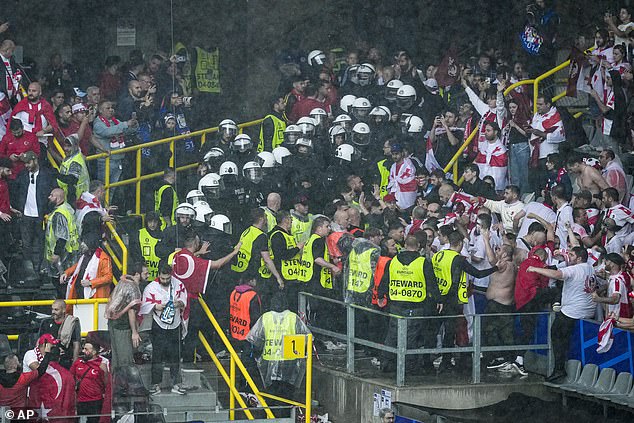 Fans of Turkey and Georgia were involved in violent scenes when they came to blows in Dortmund