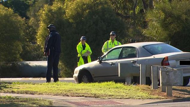 A 22-year-old woman had her license revoked and was ticketed for reckless driving (pictured shows the driver's car at the scene of the accident)