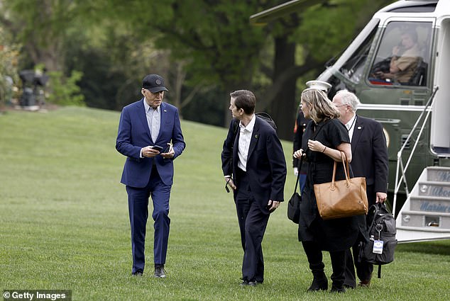 The White House is trying to calm staff fears after President Joe Biden's debate performance — above Biden with his deputy chief of staff Bruce Reed, senior adviser Mike Donilon and deputy chief of staff Annie Tomasini