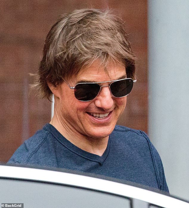 As the Mission Impossible star turned 62 on Wednesday, he flashed his famous smile as he prepared to board the helicopter
