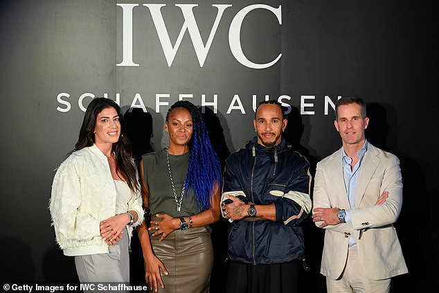 Lewis Hamilton was snapped beaming on the podium as he posed with Vicky Piria, Lucy Hedges and Cristoph Grainger-Herr