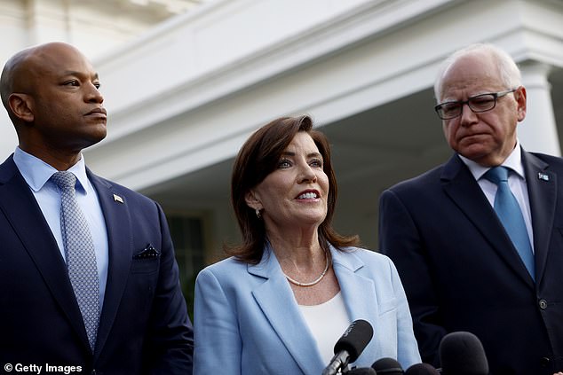 New York Democratic Governor Kathy Hochul (pictured center) unanimously offered her support for the ailing president, 81, after the rally, but other politicians present say she has no right to