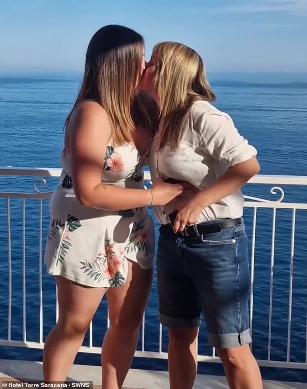 After popping the question, the two shared a romantic kiss by the ocean