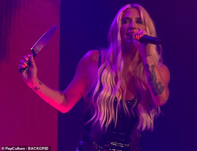 And the star put in quite a performance, as she brandished a large knife on stage and sang her latest single
