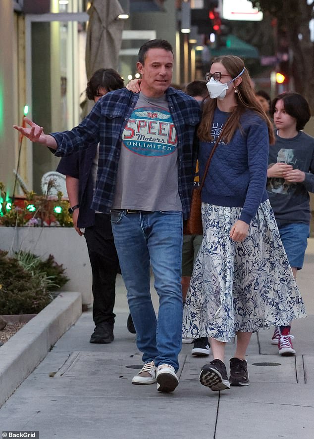 The actor dressed casually in a checked shirt, gray T-shirt and jeans, while Violet opted for a navy sweater and a white and blue patterned skirt.