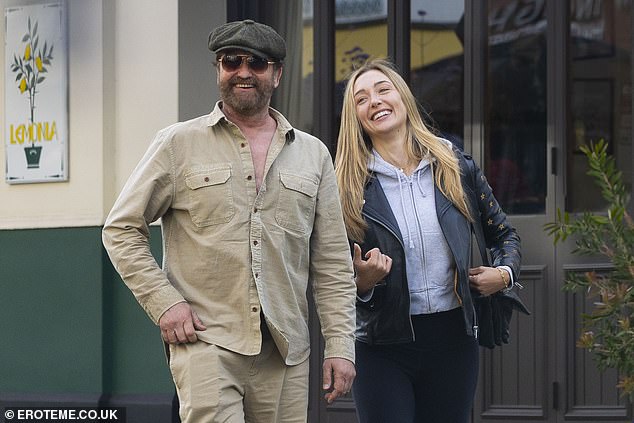 The 54-year-old actor put on a cosy show with Penny as they headed to the Queen's pub in Primrose Hill for lunch this week