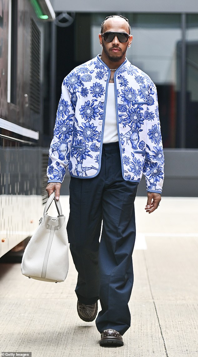 Lewis showed his sense of style in a blue and white jacket