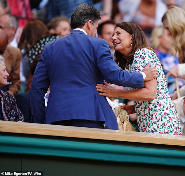 Both also laughed as they chatted with other attendees, including Sebastian Coe (left, talking to Carole), the president of the International Association of Athletics Federations