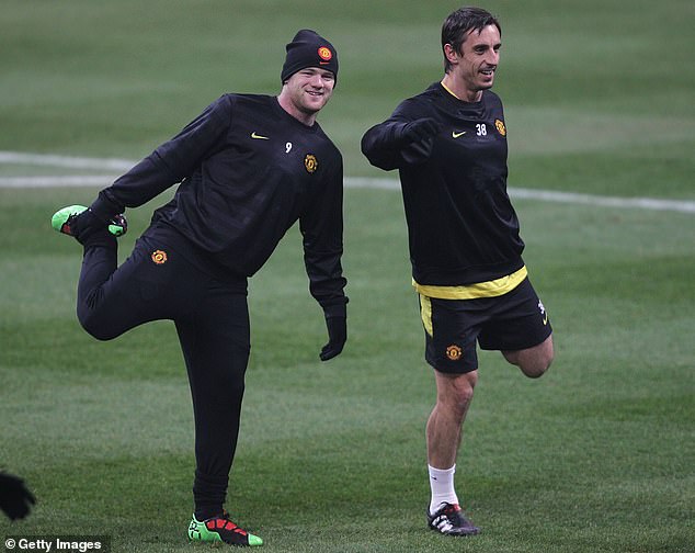 Rooney and Neville (right) are good friends and played together for seven seasons at United