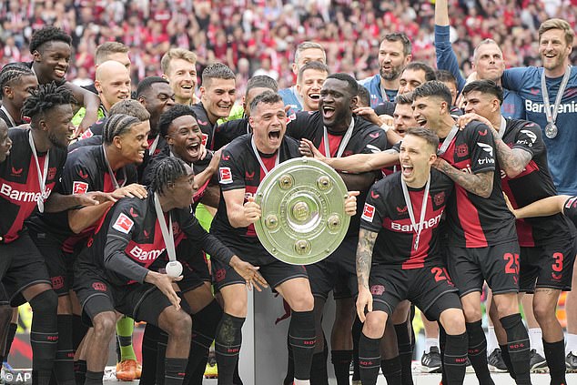 Xhaka (centre) was vital as Bayer Leverkusen completed a historic domestic double