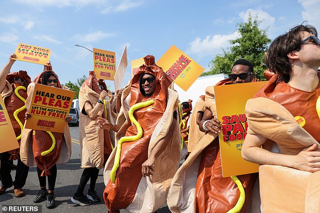 WHO LET THE DOGS OUT: People wore hot dog costumes in a parking lot in Coney Island, NYC