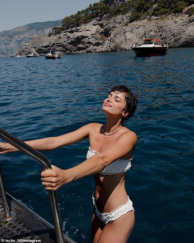 The 28-year-old cover girl stunned in a tiny two-piece while out in the Mediterranean, with her hair short and tousled