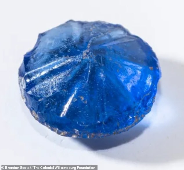A blue glass button was found, still shining as if it had been freshly made