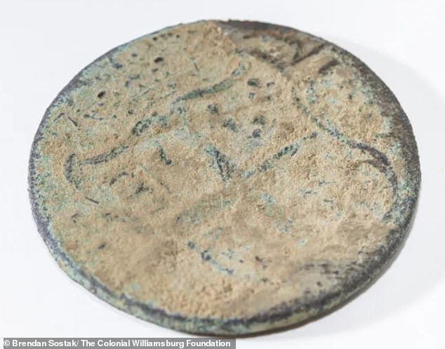A 250-year-old Virginia half penny was also found in the earth