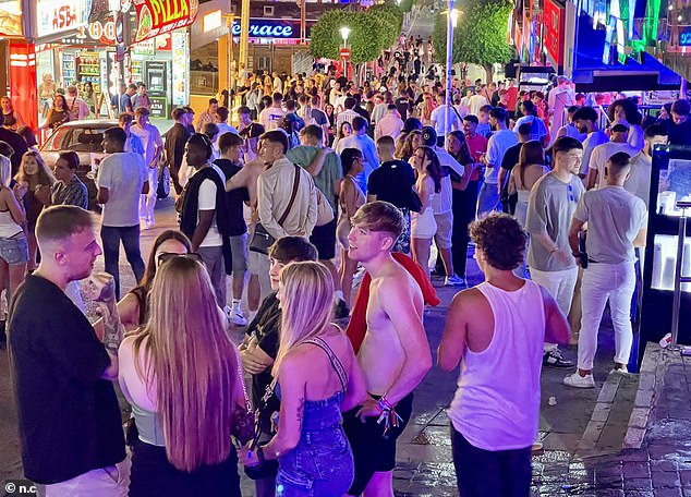 Holidaymakers fill the streets outside Magaluf's nightlife