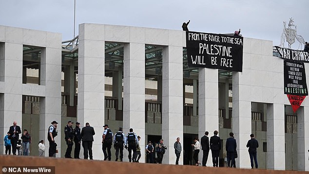 Pro-Palestine protesters climbed to the roof of the parliament building in a show of support for Palestine. Photo: NewsWire/ Martin Ollman