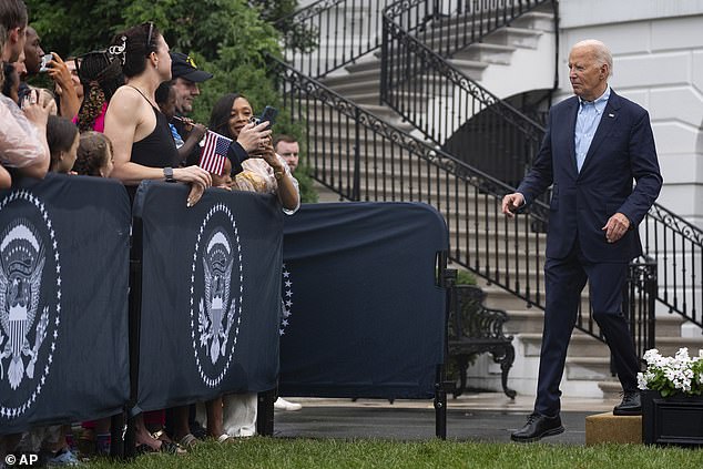 President Joe Biden walks to attendees at Thursday night's Fourth of July picnic, which is set up specifically for military families