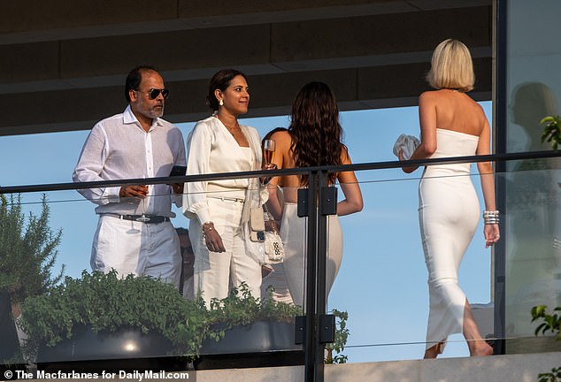 Before their arrival, several less conspicuous guests were seen chatting at the sports mogul's posh estate, dressed to the nines in aesthetically pleasing outfits