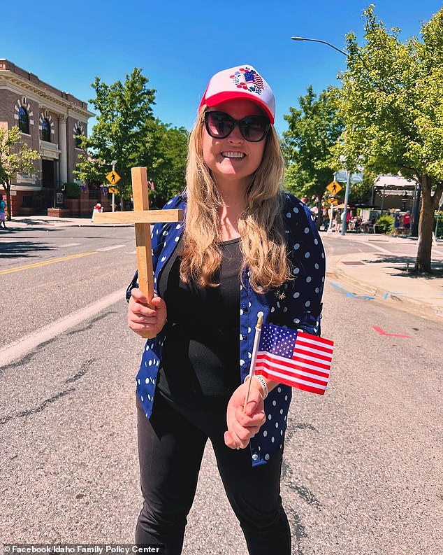 While some carried crosses next to Old Glory, others wore T-shirts with the symbol of the cross on them