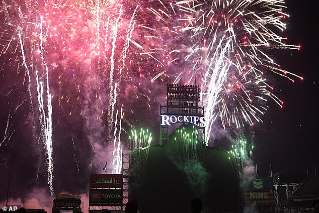 Fireworks light up the sky over Coors Field to celebrate Independence Day after the Colorado Rockies defeated the Milwaukee Brewers in a baseball game on Thursday, July 4, 2024, in Denver