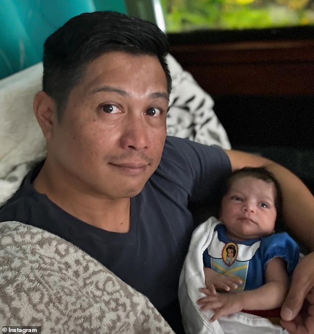 Two-month-old baby girl Diana Sofia De Los Santos, pictured with her father Romer, died after being left in the back of a hot car