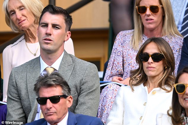 The 31-year-old sat next to his glamorous wife Becky, who wore a white jacket with striking gold buttons for the event